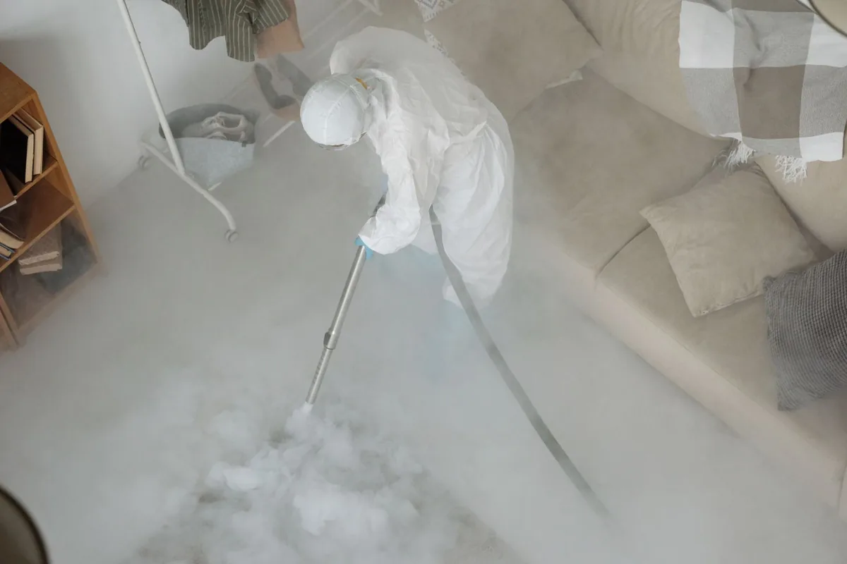 Biohazard cleanup technician in protective equipment, Mead, CO